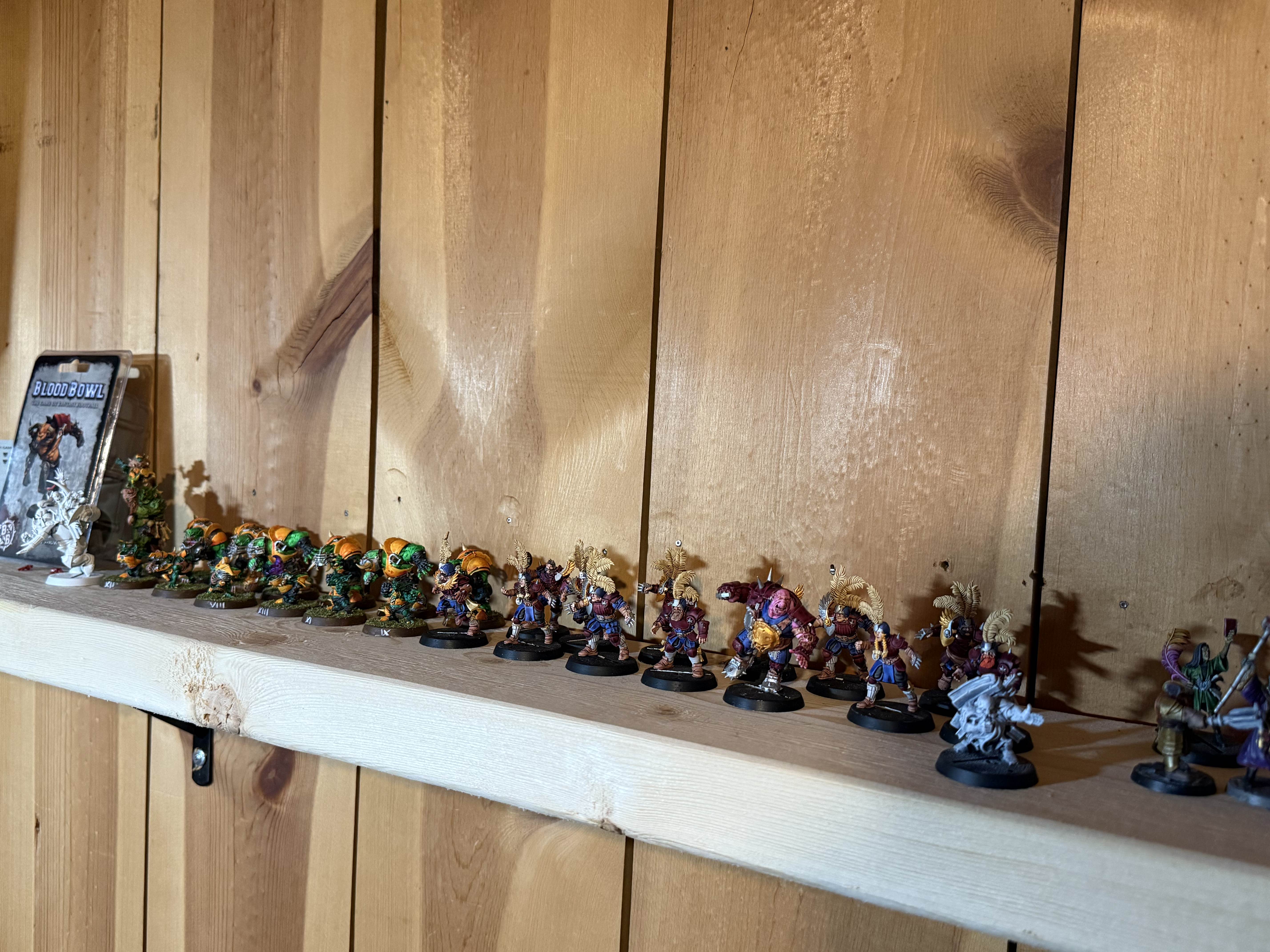 A shelf full of painted plastic bad guys.